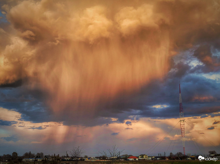 Zápor a naplemente festésében a Lakihegyi adótorony társaságával